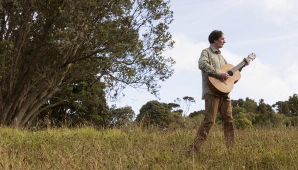 Dave Flynn in a field with trees